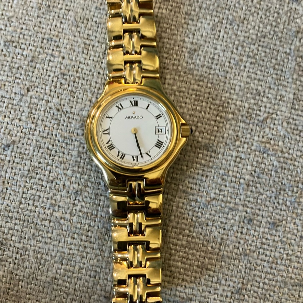 Movado unisex gold band white face watch
